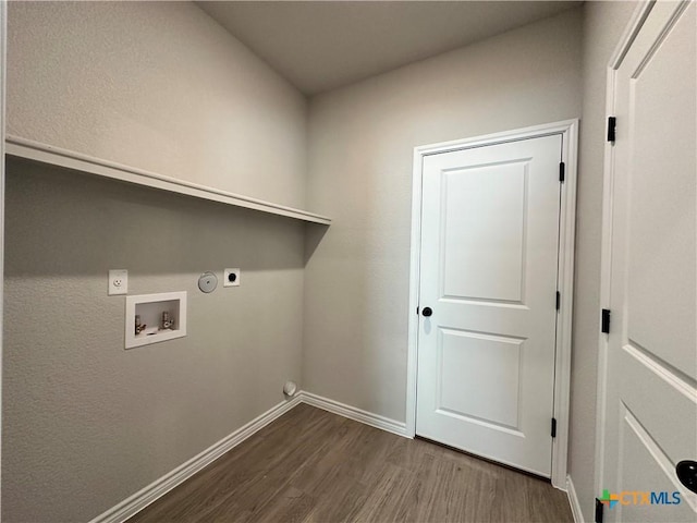 washroom with hookup for an electric dryer, hookup for a washing machine, gas dryer hookup, and dark wood-type flooring