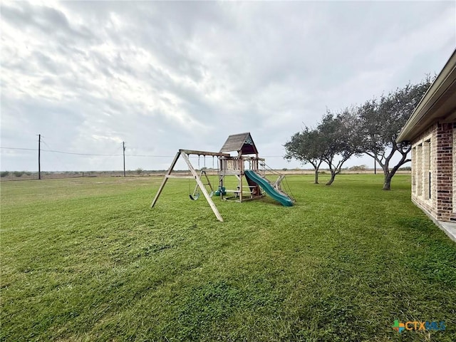 view of playground featuring a yard