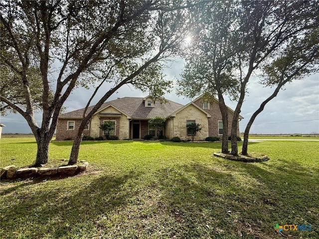 view of front of home with a front lawn