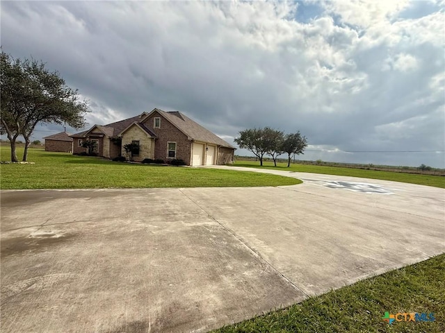 view of front of house with a garage and a front yard