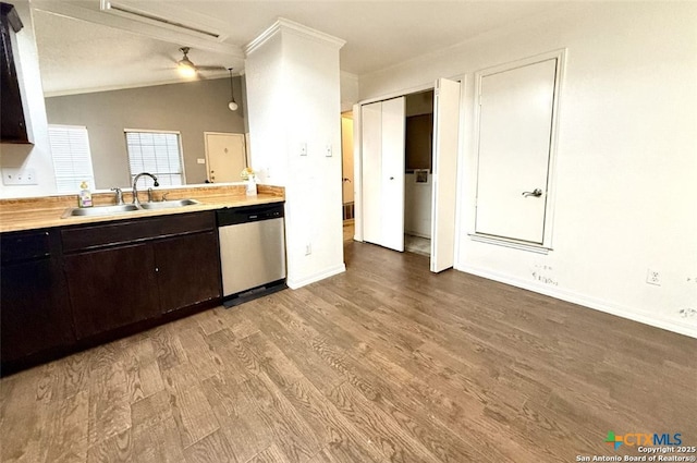 kitchen featuring lofted ceiling, sink, ornamental molding, dishwasher, and light hardwood / wood-style floors