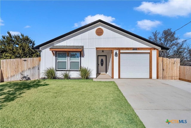 view of front facade with a garage and a front lawn