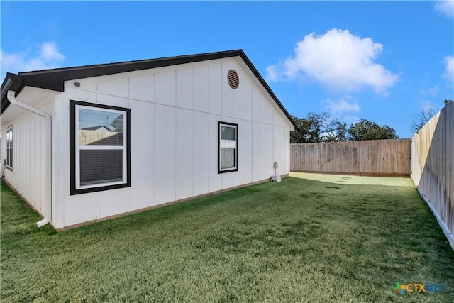 view of home's exterior with a yard