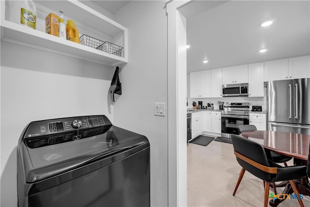 clothes washing area featuring washer / clothes dryer