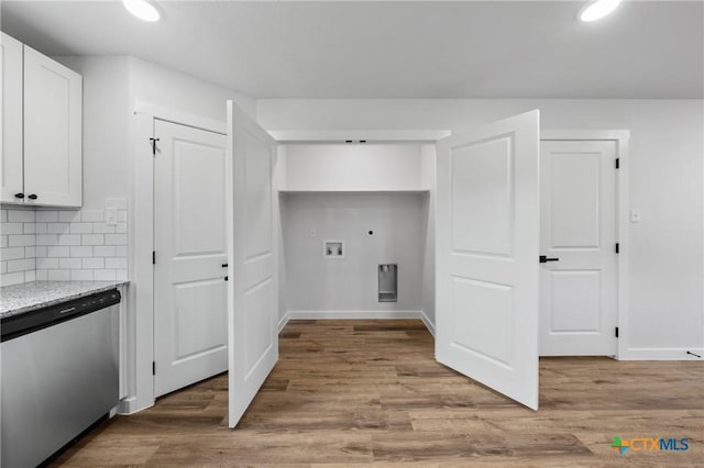 laundry area with washer hookup, light wood-type flooring, hookup for a gas dryer, and electric dryer hookup