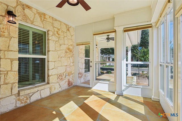 unfurnished sunroom with a wealth of natural light