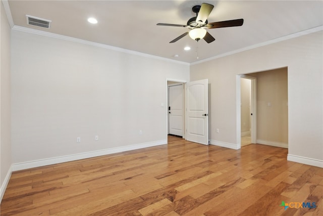 unfurnished room featuring light hardwood / wood-style flooring, ceiling fan, and ornamental molding