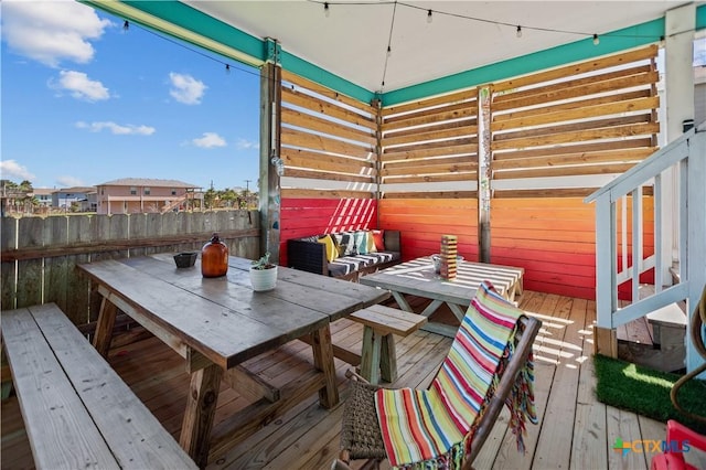 deck featuring outdoor dining area