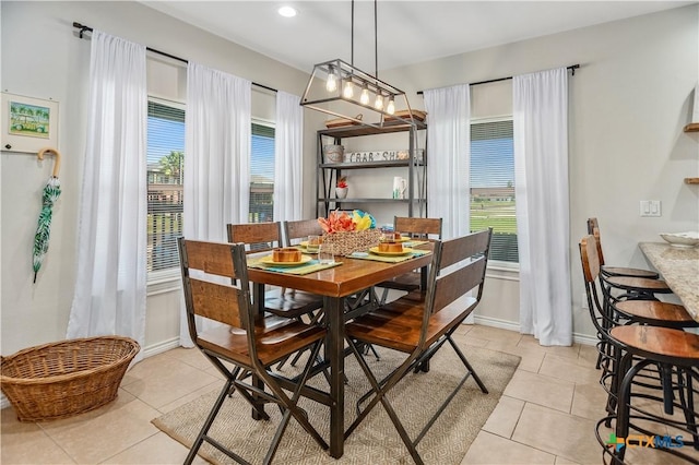 dining room featuring recessed lighting, baseboards, and light tile patterned flooring