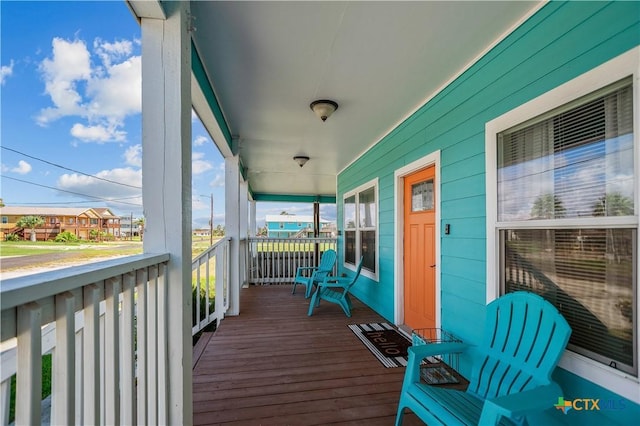 wooden terrace with a porch