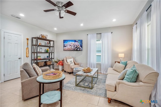 living room with a ceiling fan, light tile patterned floors, recessed lighting, and visible vents