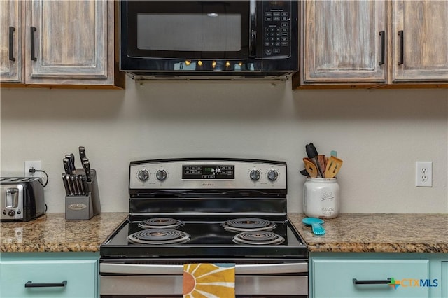 kitchen with stainless steel range with electric stovetop, black microwave, and a toaster