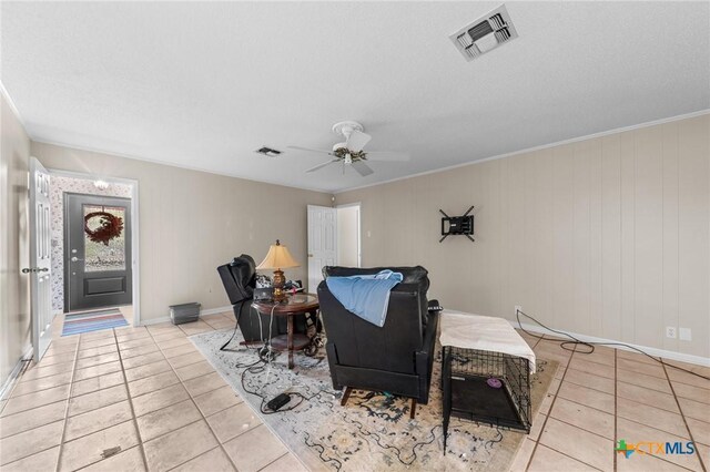 interior space with baseboards, ceiling fan, wood finished floors, and visible vents