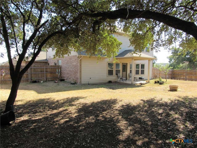 back of property with a patio area