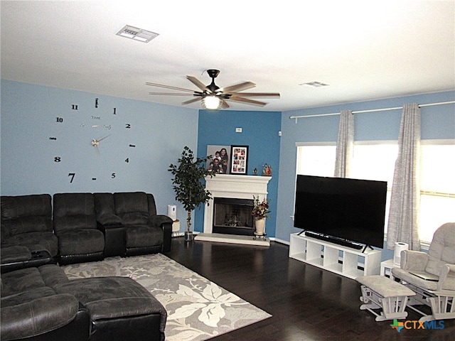 living room with ceiling fan and wood-type flooring