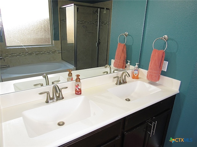 bathroom with a tub and vanity