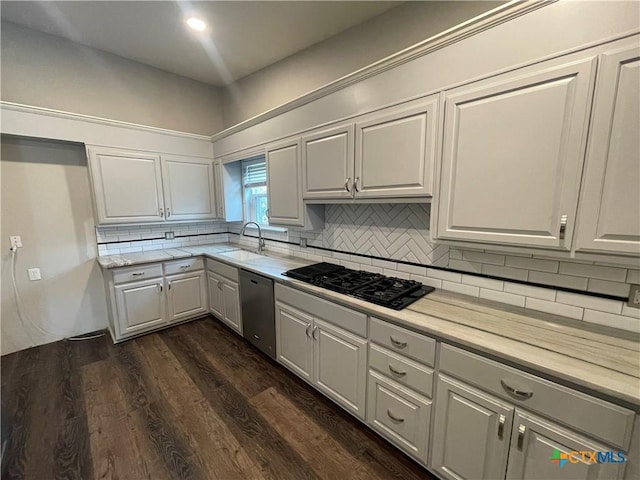 kitchen featuring black gas cooktop, dark wood-type flooring, a sink, stainless steel dishwasher, and decorative backsplash