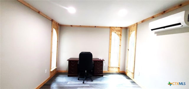 office space with a wall mounted AC and dark hardwood / wood-style floors