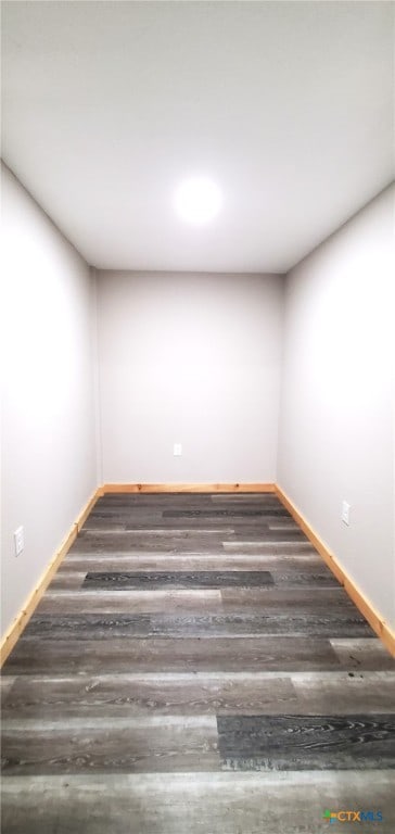 unfurnished room with dark hardwood / wood-style floors