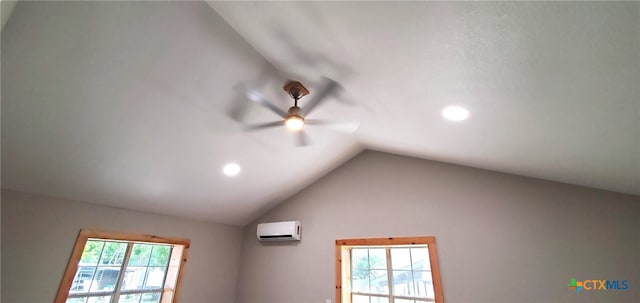 interior details featuring a wall mounted AC and ceiling fan