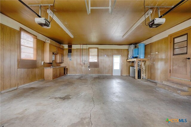 1001 US Highway 77 N, Hallettsville, TX 77964 - garage with a garage door opener and wood walls