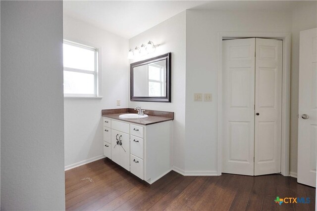 1001 US Highway 77 N, Hallettsville, TX 77964 - bathroom with wood finished floors, baseboards, and vanity