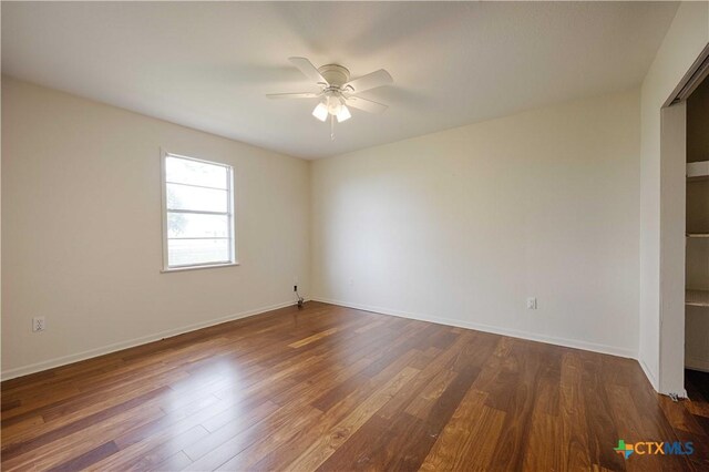 1001 US Highway 77 N, Hallettsville, TX 77964 - spare room with ceiling fan, dark wood-style flooring, and baseboards