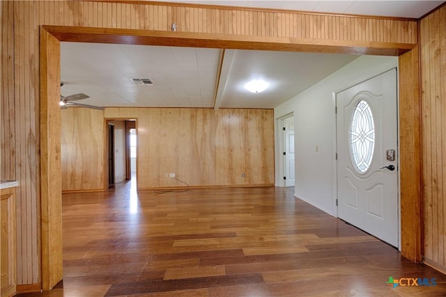 1001 US Highway 77 N, Hallettsville, TX 77964 - foyer with wood finished floors, wooden walls, a ceiling fan, and baseboards