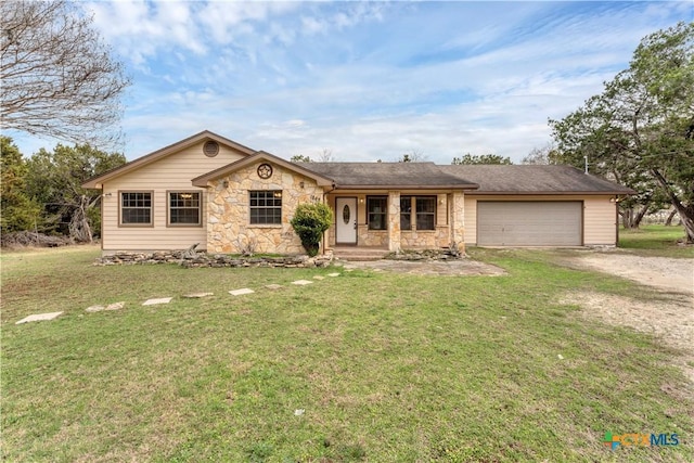 single story home featuring a garage and a front lawn