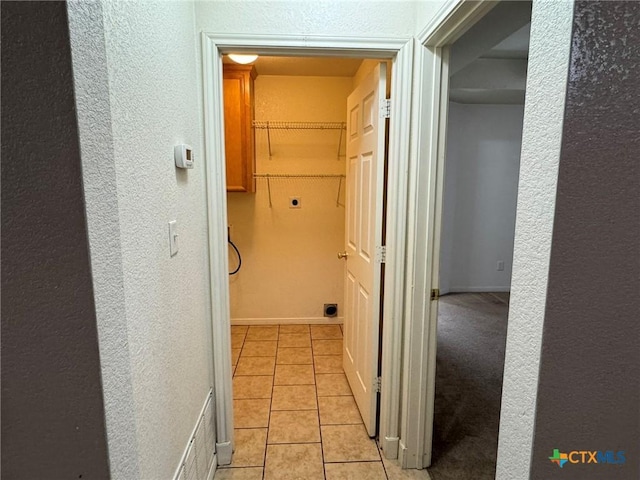 hallway with light tile patterned flooring