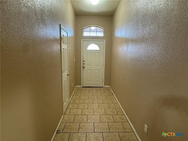 doorway featuring light tile patterned floors