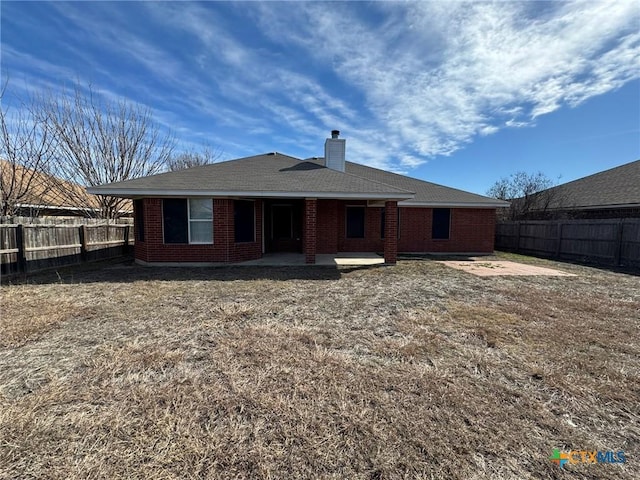 back of property with a patio area