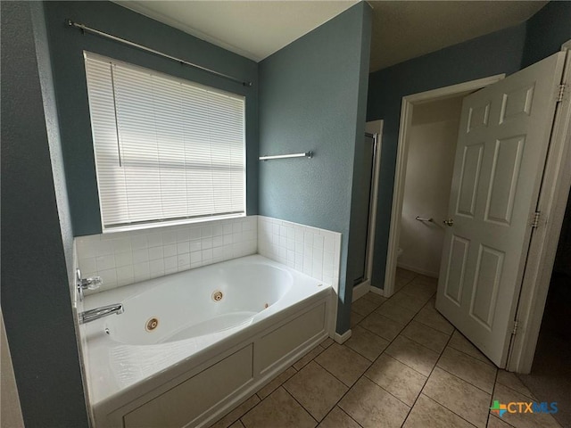 bathroom with independent shower and bath, tile patterned floors, and toilet