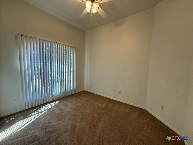 carpeted empty room featuring ceiling fan