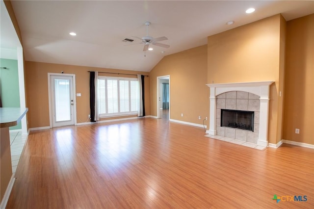 106 Fieldstone, Victoria, TX 77901 - unfurnished living room featuring ceiling fan, wood finished floors, a fireplace, vaulted ceiling, and recessed lighting