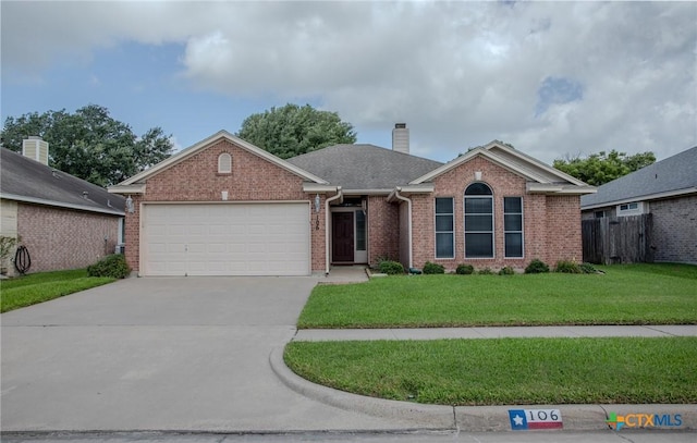106 Fieldstone, Victoria, TX 77901 - ranch-style house featuring brick siding, an attached garage, concrete driveway, and a chimney