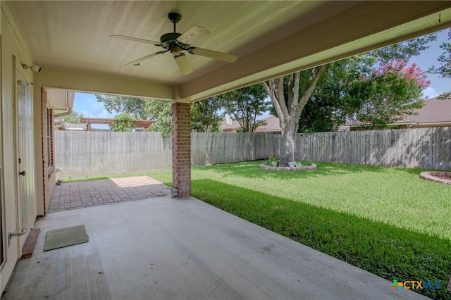 106 Fieldstone, Victoria, TX 77901 - fenced backyard with a ceiling fan and a patio