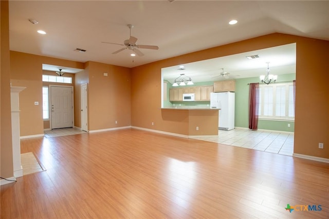 106 Fieldstone, Victoria, TX 77901 - unfurnished living room with ceiling fan, a chandelier, light wood-style floors, and recessed lighting
