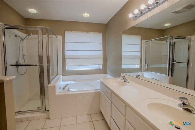 106 Fieldstone, Victoria, TX 77901 - bathroom with tile patterned floors, a bath, a shower stall, and double vanity