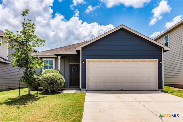 view of front facade with a garage and a front yard