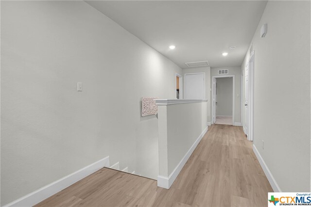 hallway featuring light hardwood / wood-style floors