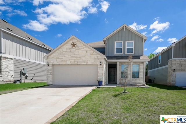 craftsman inspired home featuring a garage and a front lawn