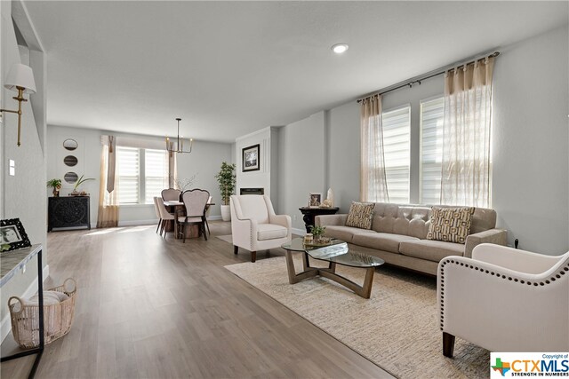 living room with light hardwood / wood-style flooring