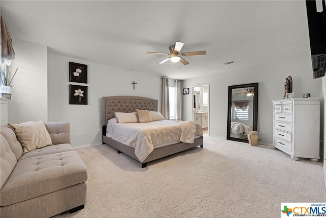 bedroom featuring ensuite bathroom, ceiling fan, and carpet floors