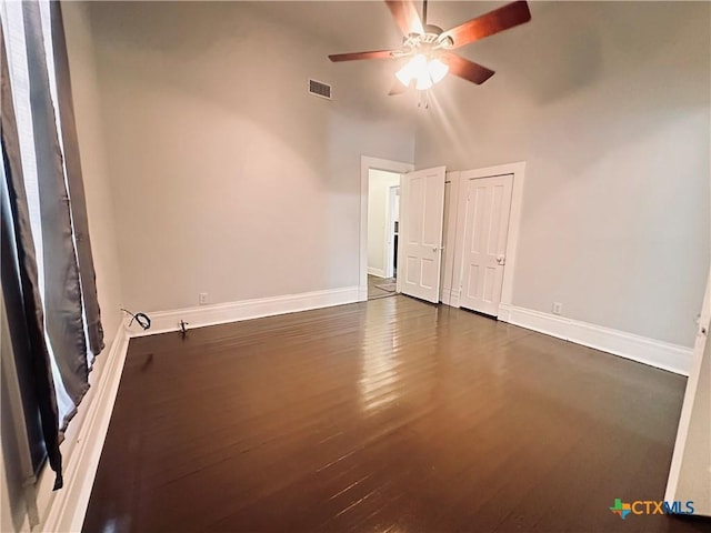 207 Schrimsher St, Yoakum, TX 77995 - unfurnished room with ceiling fan and dark wood-type flooring