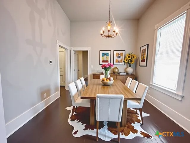 207 Schrimsher St, Yoakum, TX 77995 - dining area featuring a chandelier and dark wood-style flooring