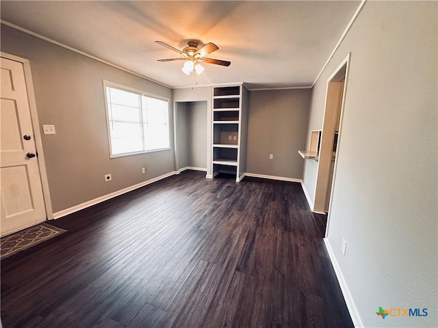 207 Schrimsher St, Yoakum, TX 77995 - unfurnished bedroom with dark wood-style flooring and a ceiling fan