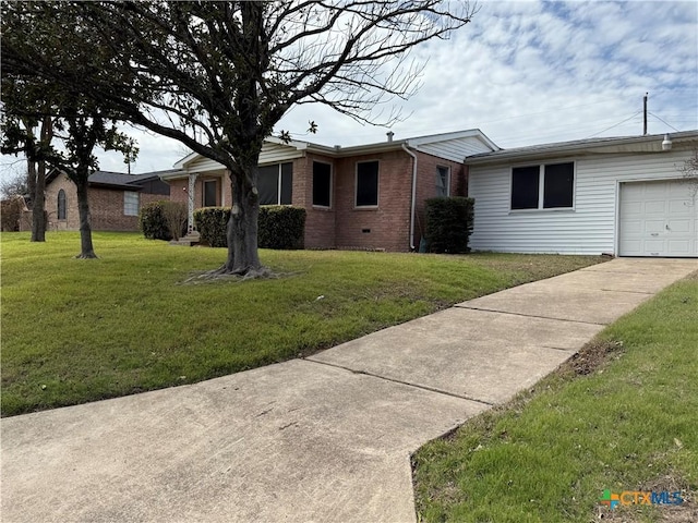 ranch-style home featuring brick siding, an attached garage, a front yard, crawl space, and driveway