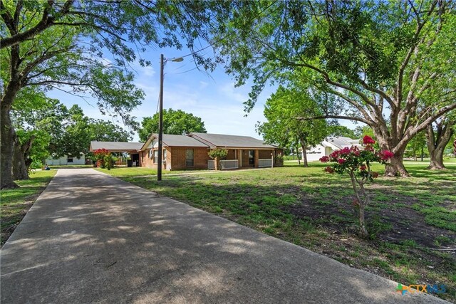 2080 Allison Rd, Martindale, TX 78655 - single story home featuring driveway and a front lawn