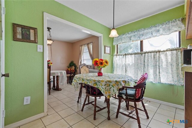 2080 Allison Rd, Martindale, TX 78655 - dining room with baseboards and light tile patterned floors